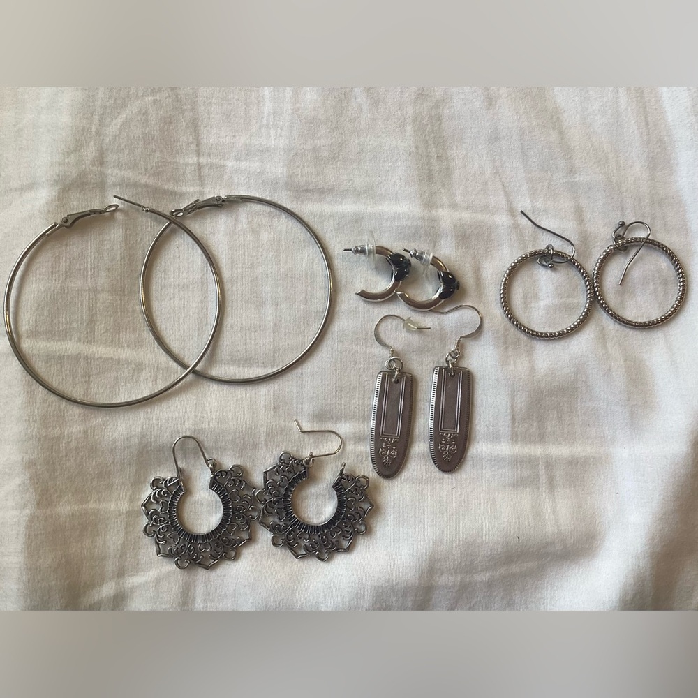 Five Silver-tone Earirings In Different Sizes And Styles